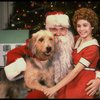 Roseanne Sorrentino as Annie w. Santa Claus and Sandy in a scene from the touring company of the musical "Annie." (Louisville)