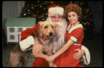 Roseanne Sorrentino as Annie w. Santa Claus and Sandy in a scene from the touring company of the musical "Annie." (Louisville)