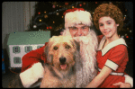 Roseanne Sorrentino as Annie w. Santa Claus and Sandy in a scene from the touring company of the musical "Annie." (Louisville)