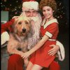 Roseanne Sorrentino as Annie w. Santa Claus and Sandy in a scene from the touring company of the musical "Annie." (Louisville)