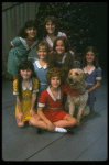 Bridget Walsh as Annie w. Sandy and orphans in a scene from a touring company of the musical "Annie." (Fort Worth)