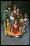 Bridget Walsh as Annie w. Sandy and orphans in a scene from a touring company of the musical "Annie." (Fort Worth)