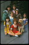 Bridget Walsh as Annie w. Sandy and orphans in a scene from a touring company of the musical "Annie." (Fort Worth)