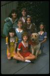 Bridget Walsh as Annie w. Sandy and orphans in a scene from a touring company of the musical "Annie." (Fort Worth)