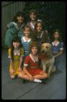 Bridget Walsh as Annie w. Sandy and orphans in a scene from a touring company of the musical "Annie." (Fort Worth)