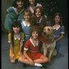 Bridget Walsh as Annie w. Sandy and orphans in a scene from a touring company of the musical "Annie." (Fort Worth)