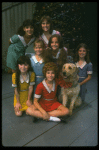 Bridget Walsh as Annie w. Sandy and orphans in a scene from a touring company of the musical "Annie." (Fort Worth)