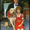 Bridget Walsh as Annie and Rhodes Reason as Daddy Warbucks w. Sandy in a scene from a touring company of the musical "Annie." (Fort Worth)