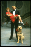 Bridget Walsh as Annie and Rhodes Reason as Daddy Warbucks w. Sandy in a scene from a touring company of the musical "Annie." (Fort Worth)