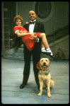 Bridget Walsh as Annie and Rhodes Reason as Daddy Warbucks w. Sandy in a scene from a touring company of the musical "Annie." (Fort Worth)