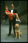 Bridget Walsh as Annie and Rhodes Reason as Daddy Warbucks w. Sandy in a scene from a touring company of the musical "Annie." (Fort Worth)