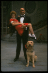 Bridget Walsh as Annie and Rhodes Reason as Daddy Warbucks w. Sandy in a scene from a touring company of the musical "Annie." (Fort Worth)