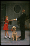 Bridget Walsh as Annie and Rhodes Reason as Daddy Warbucks w. Sandy in a scene from a touring company of the musical "Annie." (Fort Worth)