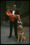 Bridget Walsh as Annie and Rhodes Reason as Daddy Warbucks w. Sandy in a scene from a touring company of the musical "Annie." (Fort Worth)