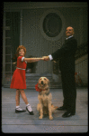 Bridget Walsh as Annie and Rhodes Reason as Daddy Warbucks w. Sandy in a scene from a touring company of the musical "Annie." (Fort Worth)