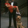 Bridget Walsh as Annie and Rhodes Reason as Daddy Warbucks w. Sandy in a scene from a touring company of the musical "Annie." (Fort Worth)