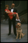 Bridget Walsh as Annie and Rhodes Reason as Daddy Warbucks w. Sandy in a scene from a touring company of the musical "Annie." (Fort Worth)