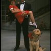 Bridget Walsh as Annie and Rhodes Reason as Daddy Warbucks w. Sandy in a scene from a touring company of the musical "Annie." (Fort Worth)