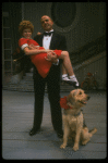 Bridget Walsh as Annie and Rhodes Reason as Daddy Warbucks w. Sandy in a scene from a touring company of the musical "Annie." (Fort Worth)