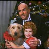 Bridget Walsh as Annie and Rhodes Reason as Daddy Warbucks w. Sandy in a scene from a touring company of the musical "Annie." (Fort Worth)