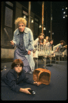 Ruth Kobart as Miss Hannigan and Louanne as Annie w. orphans in a scene from a touring company of the musical "Annie." (Boston)