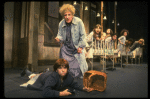 Ruth Kobart as Miss Hannigan and Louanne as Annie w. orphans in a scene from a touring company of the musical "Annie." (Boston)
