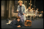 Ruth Kobart as Miss Hannigan and Louanne as Annie w. orphans in a scene from a touring company of the musical "Annie." (Boston)