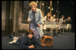 Ruth Kobart as Miss Hannigan and Louanne as Annie w. orphans in a scene from a touring company of the musical "Annie." (Boston)