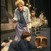 Ruth Kobart as Miss Hannigan and Louanne as Annie w. orphans in a scene from a touring company of the musical "Annie." (Boston)