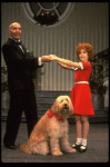 Norwood Smith as Daddy Warbucks and Louanne as Annie w. Sandy in a scene from a touring company of the musical "Annie." (Boston)