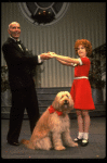 Norwood Smith as Daddy Warbucks and Louanne as Annie w. Sandy in a scene from a touring company of the musical "Annie." (Boston)