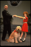 Norwood Smith as Daddy Warbucks and Louanne as Annie w. Sandy in a scene from a touring company of the musical "Annie." (Boston)