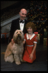 Norwood Smith as Daddy Warbucks and Louanne as Annie w. Sandy in a scene from a touring company of the musical "Annie." (Boston)