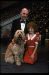 Norwood Smith as Daddy Warbucks and Louanne as Annie w. Sandy in a scene from a touring company of the musical "Annie." (Boston)