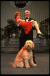 Norwood Smith as Daddy Warbucks and Louanne as Annie w. Sandy in a scene from a touring company of the musical "Annie." (Boston)