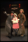 Martha Whitehead as Grace, Louanne as Annie and Norwood Smith as Daddy Warbucks in a scene from a touring company of the musical "Annie." (Boston)