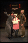 Martha Whitehead as Grace, Louanne as Annie and Norwood Smith as Daddy Warbucks in a scene from a touring company of the musical "Annie." (Boston)