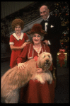 Ruth Kobart as Miss Hannigan, Louanne as Annie, and Norwood Smith as Daddy Warbucks w. Sandy in a scene from a touring company of the musical "Annie." (Boston)