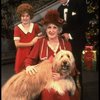 Ruth Kobart as Miss Hannigan, Louanne as Annie, and Norwood Smith as Daddy Warbucks w. Sandy in a scene from a touring company of the musical "Annie." (Boston)
