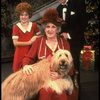 Ruth Kobart as Miss Hannigan, Louanne as Annie, and Norwood Smith as Daddy Warbucks w. Sandy in a scene from a touring company of the musical "Annie." (Boston)