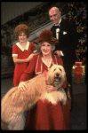 Ruth Kobart as Miss Hannigan, Louanne as Annie, and Norwood Smith as Daddy Warbucks w. Sandy in a scene from a touring company of the musical "Annie." (Boston)