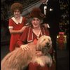 Ruth Kobart as Miss Hannigan, Louanne as Annie, and Norwood Smith as Daddy Warbucks w. Sandy in a scene from a touring company of the musical "Annie." (Boston)
