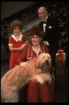 Ruth Kobart as Miss Hannigan, Louanne as Annie, and Norwood Smith as Daddy Warbucks w. Sandy in a scene from a touring company of the musical "Annie." (Boston)