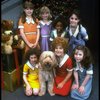 Louanne as Annie w. orphans and Sandy in a scene from a touring company of the musical "Annie." (Boston)