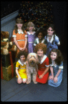 Louanne as Annie w. orphans and Sandy in a scene from a touring company of the musical "Annie." (Boston)