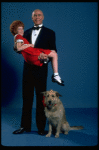 Allison Smith as Annie and Harve Presnell as Daddy Warbucks w. Sandy in a scene from the Broadway production of the musical "Annie." (New York)
