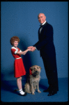 Allison Smith as Annie and Harve Presnell as Daddy Warbucks w. Sandy in a scene from the Broadway production of the musical "Annie." (New York)