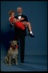 Mollie Hall as Annie and Ron Holgate as Daddy Warbucks w. Sandy in a scene from a touring company of the musical "Annie."