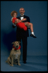 Mollie Hall as Annie and Ron Holgate as Daddy Warbucks w. Sandy in a scene from a touring company of the musical "Annie."