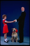 Kathleen Sisk as Annie and Gary Holcombe as Daddy Warbucks w. Sandy in a scene from a touring company of the musical "Annie." (Atlanta)